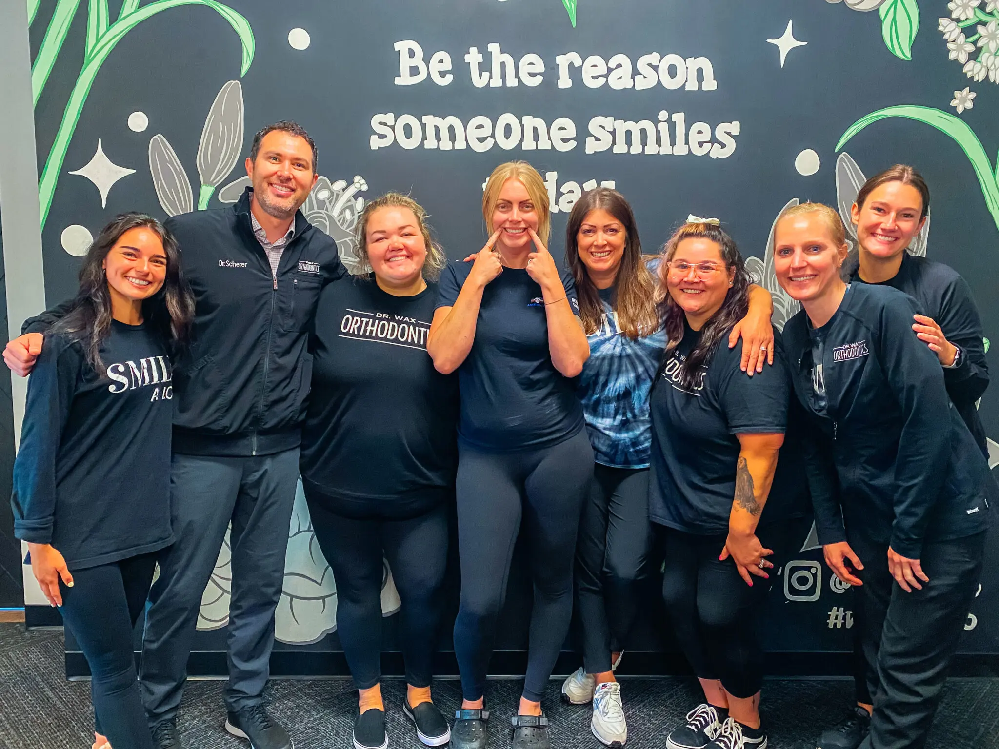 Team members at Dr. Wax Orthodontics share smiles and positivity together.