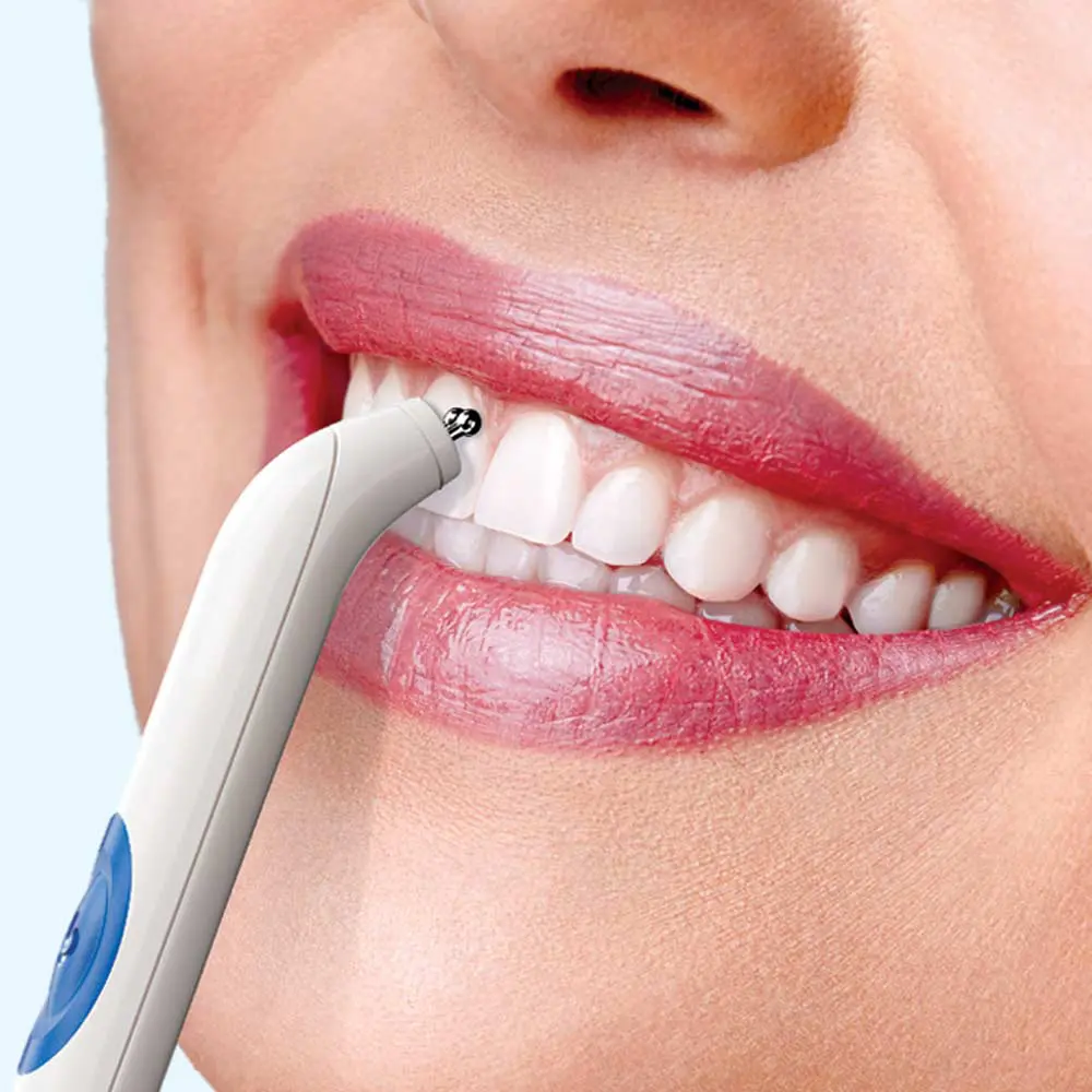 A reassuring smile during a gentle orthodontic procedure.