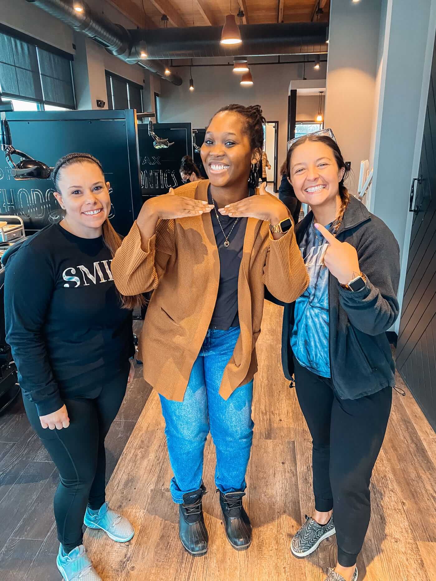 dr-wax-orthodontics-employees-with-smiling-patient