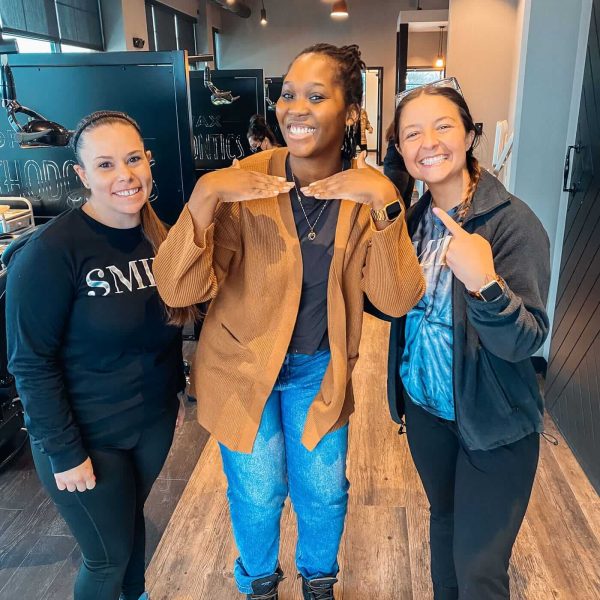 Happy patients and team member sharing smiles together at Dr. Wax Orthodontics.