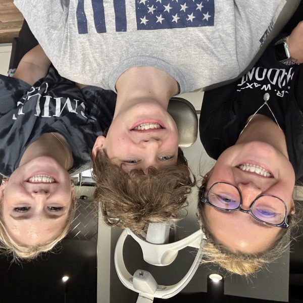 Smiling team and patient sharing a joyful moment at Dr. Wax Orthodontics.