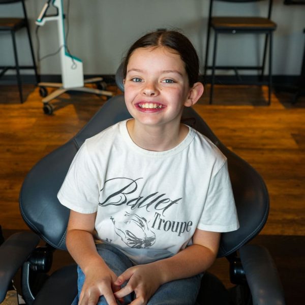 Patient smiling at Dr. Wax Orthodontics orthodontist office in Linden, MI.