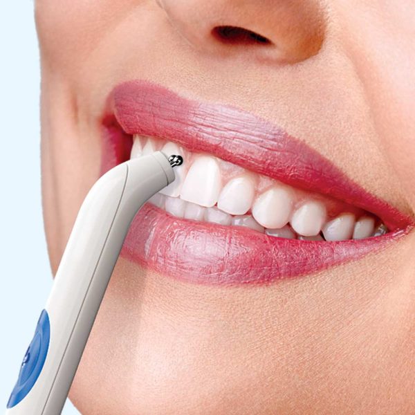 A reassuring smile during a gentle orthodontic procedure.